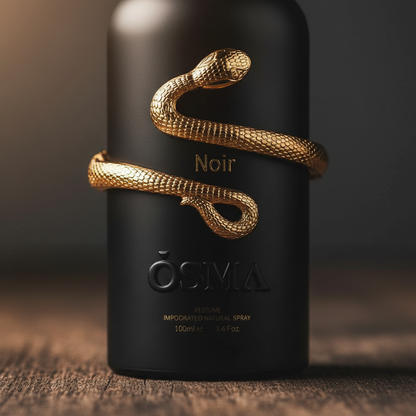 Close-up detail of gold snake on Noir by OSMA perfume bottle