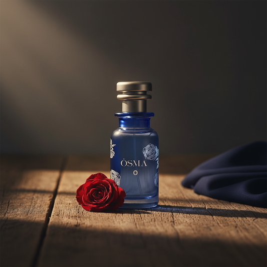 OSMA O luxury perfume bottle lifestyle shot with rose prop on dark wood
