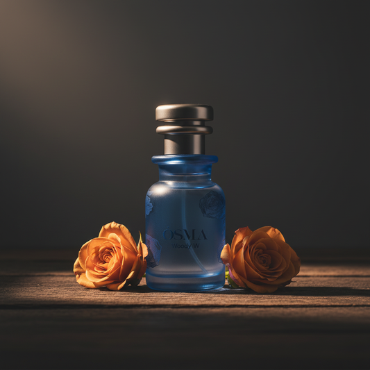 OSMA Woody W perfume bottle lifestyle shot with rose bloom on dark wood